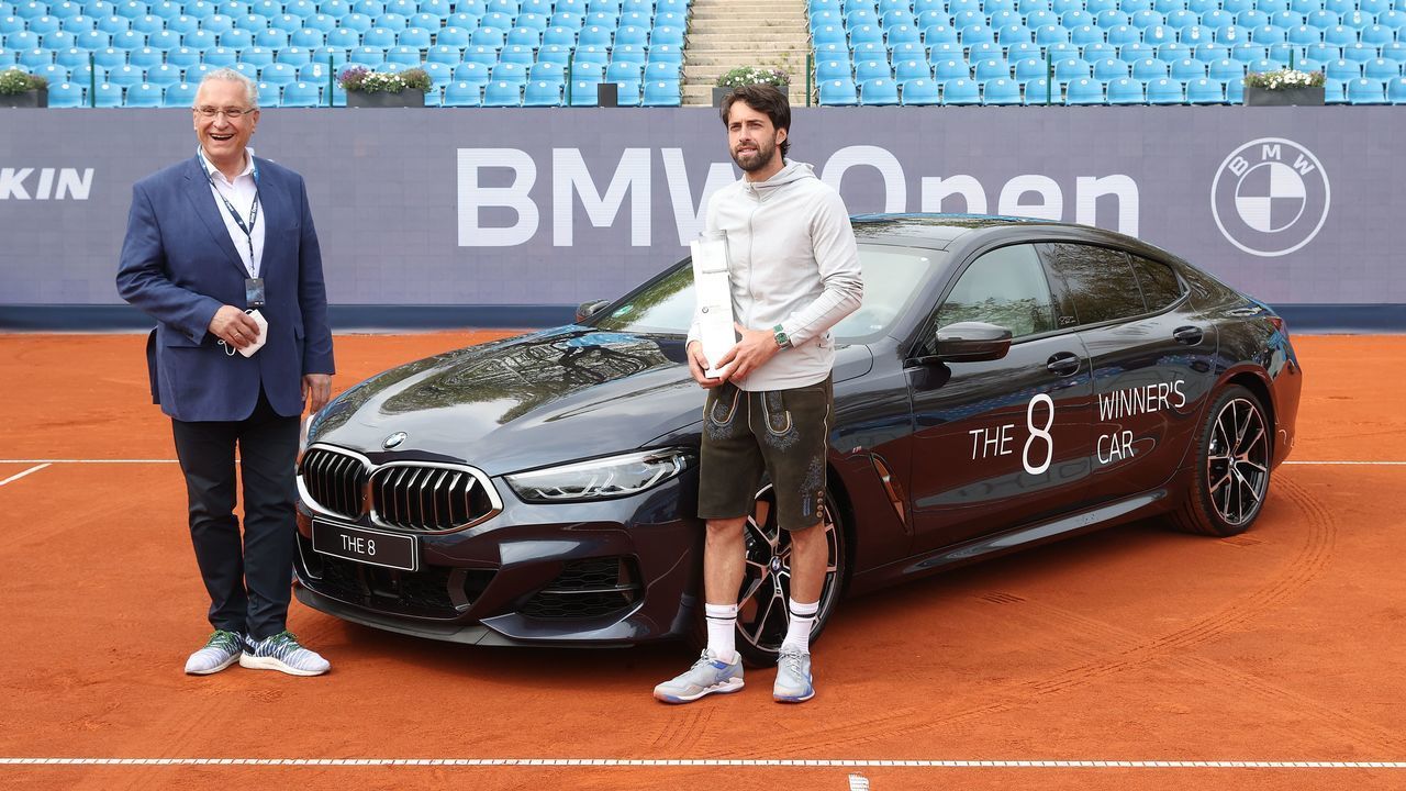 MUNICH, GERMANY - MAY 02: Bavarian Interior Minister Joachim Hermann poses with Nikoloz Basilashvili of Georgia and his winner trophy after winning his finale match against Jan-Lennard Struff of Germany on day 9 of the BMW Open at MTTC IPHITOS on May 02, 2021 in Munich, Germany.