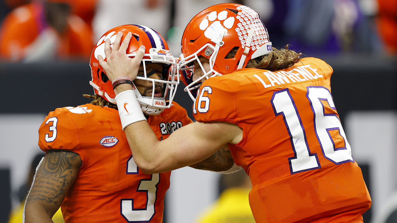 NEW ORLEANS, LOUISIANA - JANUARY 13: Trevor Lawrence #16 of the Clemson Tigers celebrates with teammate Amari Rodgers #3 of the Clemson Tigers after he made the two point conversion during the third quarter in the College Football Playoff National Championship game at Mercedes Benz Superdome on January 13, 2020 in New Orleans, Louisiana.