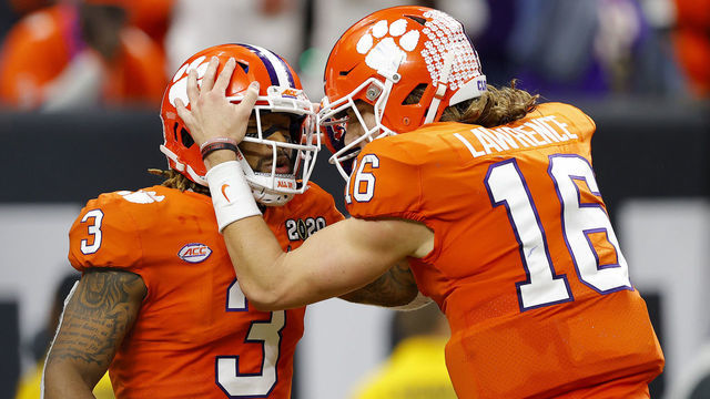 NEW ORLEANS, LOUISIANA - JANUARY 13: Trevor Lawrence #16 of the Clemson Tigers celebrates with teammate Amari Rodgers #3 of the Clemson Tigers after he made the two point conversion during the third quarter in the College Football Playoff National Championship game at Mercedes Benz Superdome on January 13, 2020 in New Orleans, Louisiana.