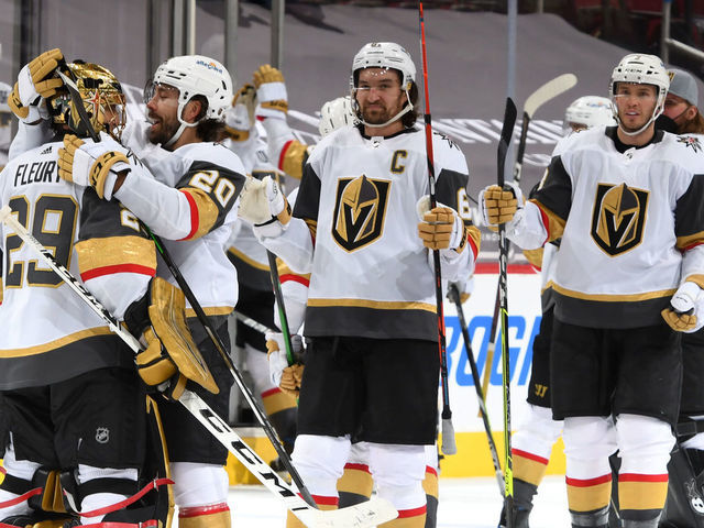 GLENDALE, ARIZONA - MAY 01: Goalie Marc-Andre Fleury #29 of the Vegas Golden Knights is congratulated by Chandler Stephenson #20 of the Golden Knights and teammates after a 3-2 overtime victory against the Arizona Coyotes during the NHL hockey game at Gila River Arena on May 01, 2021 in Glendale, Arizona.
