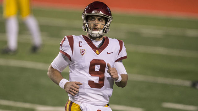 SALT LAKE CITY, UT - NOVEMBER 21: Kedon Slovis #8 of the USC Trojans jobs off the field during their game against the Utah Utes November 21, 2020 at Rice Eccles Stadium in Logan, Utah.