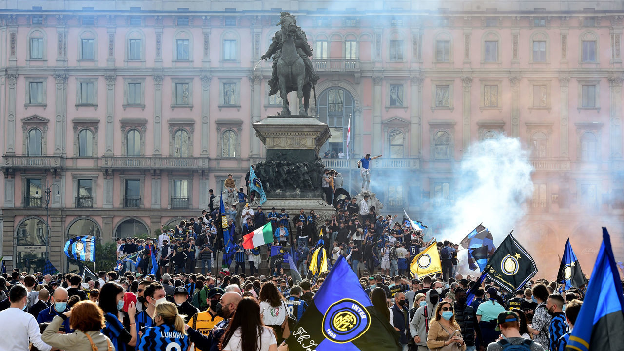 MILAN, ITALY - MAY 02: Inter fans celebrate the victory of the 19th Serie A football championship in Piazza del Duomo, in Milan, Italy on May 02, 2021. Inter Milan were crowned champions of Italian Serie A after second-place Atalanta's 1-1 draw against Sassuolo on Sunday.