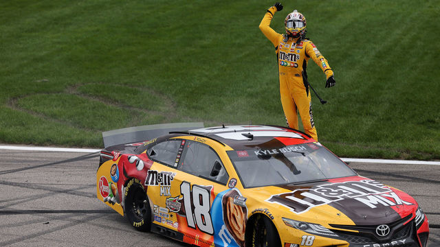 KANSAS CITY, KANSAS - MAY 02: Kyle Busch, driver of the #18 M&M's Mix Toyota, celebrates after winning the NASCAR Cup Series Buschy McBusch Race 400 at Kansas Speedway on May 02, 2021 in Kansas City, Kansas.