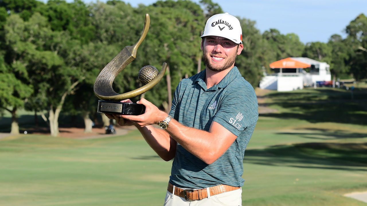 PALM HARBOR, FLORIDA - MAY 02: Sam Burns of the United States celebrates with the trophy after winning during the final round of the Valspar Championship on the Copperhead Course at Innisbrook Resort on May 02, 2021 in Palm Harbor, Florida.