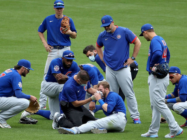 Cubs outfielder Ian Happ carted off the field as the former Bearcat faces  the Reds