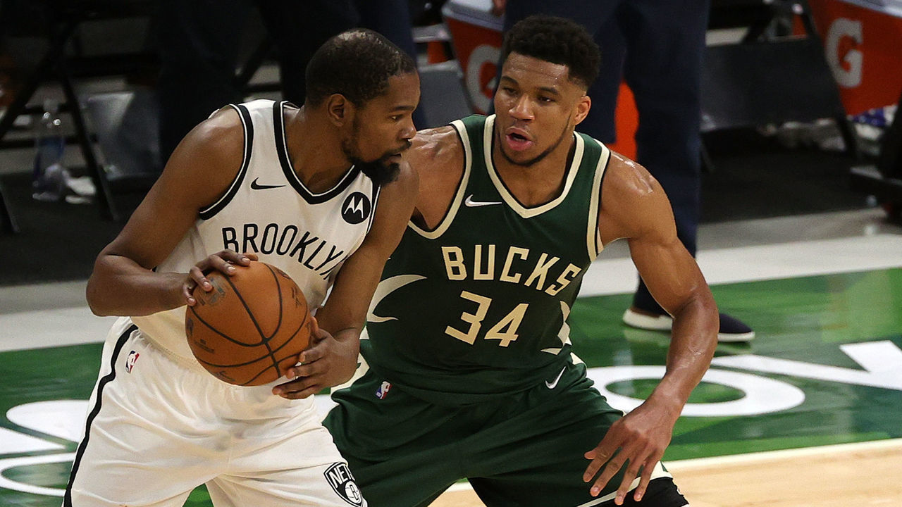 MILWAUKEE, WISCONSIN - MAY 02: Kevin Durant #7 of the Brooklyn Nets is defended by Giannis Antetokounmpo #34 of the Milwaukee Bucks during the second half of a game at Fiserv Forum on May 02, 2021 in Milwaukee, Wisconsin.