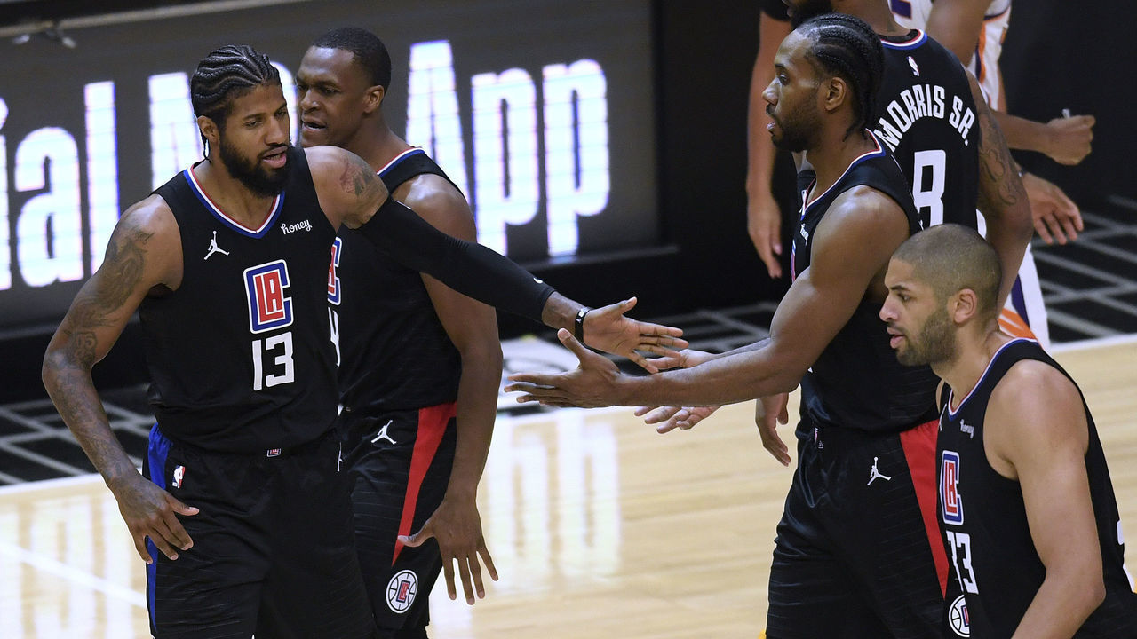 LOS ANGELES, CALIFORNIA - APRIL 08: Paul George #13 of the LA Clippers celebrates a lead with Kawhi Leonard #2 after a tinmeout during the fourth quarter in a 113-103 Clippers win over the Phoenix Suns at Staples Center on April 08, 2021 in Los Angeles, California.