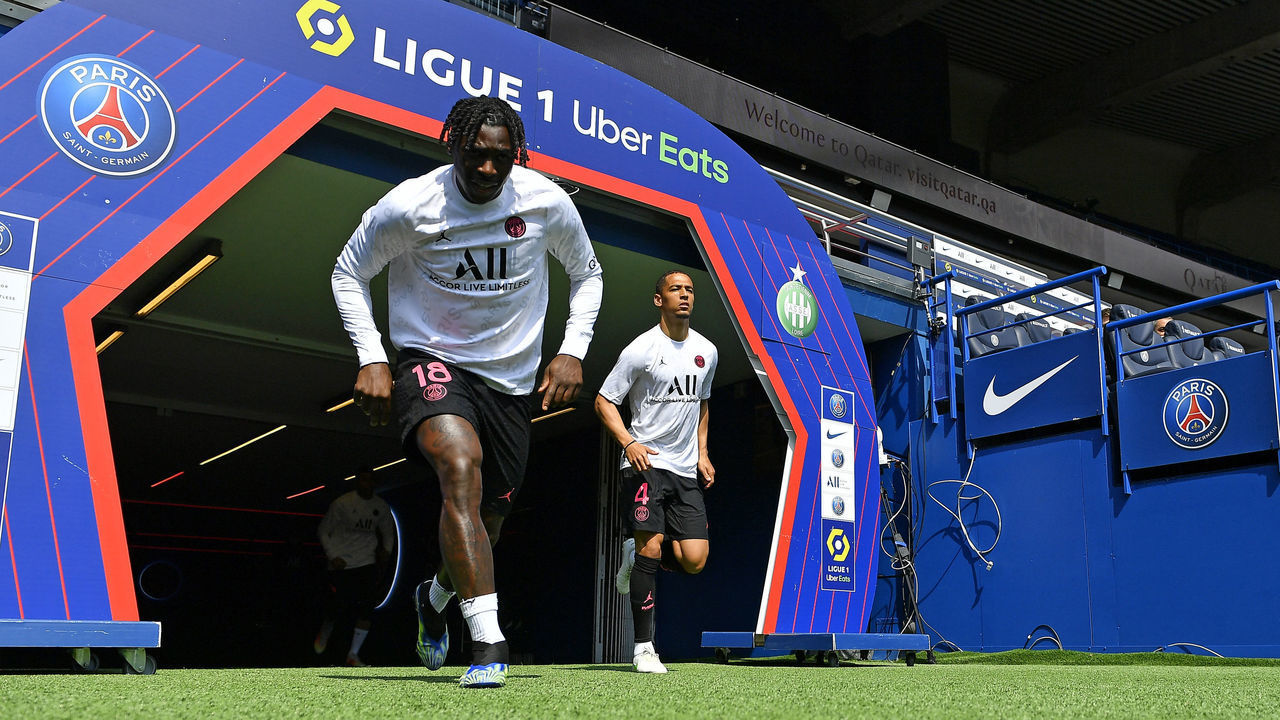 PARIS, FRANCE - APRIL 18: Moise Kean and Thilo Kehrer of Paris Saint-Germain arrive on the pitch for warmup before the Ligue 1 match between Paris Saint-Germain and AS Saint-Etienne at Parc des Princes on April 18, 2021 in Paris, France.