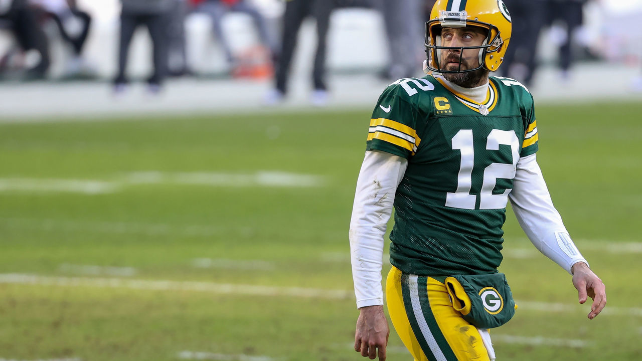 GREEN BAY, WISCONSIN - JANUARY 24: Aaron Rodgers #12 of the Green Bay Packers walks across the field in the second quarter against the Tampa Bay Buccaneers during the NFC Championship game at Lambeau Field on January 24, 2021 in Green Bay, Wisconsin.