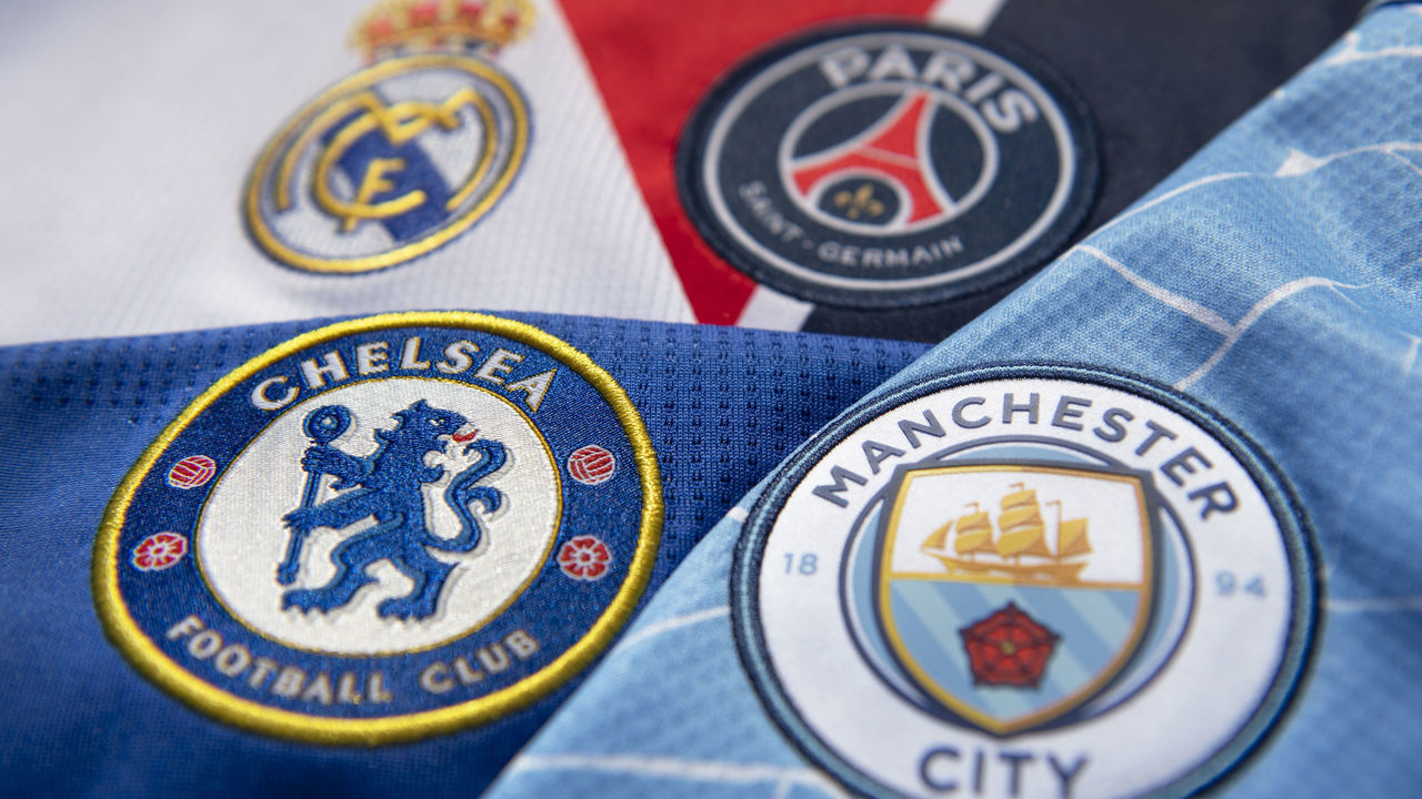 MANCHESTER, ENGLAND - APRIL 22: The club badges of the four UEFA Champions League semi finalists Manchester City, Paris Saint-Germain, Chelsea and Real Madrid on their first team home shirts on April 22, 2021 in Manchester, United Kingdom.
