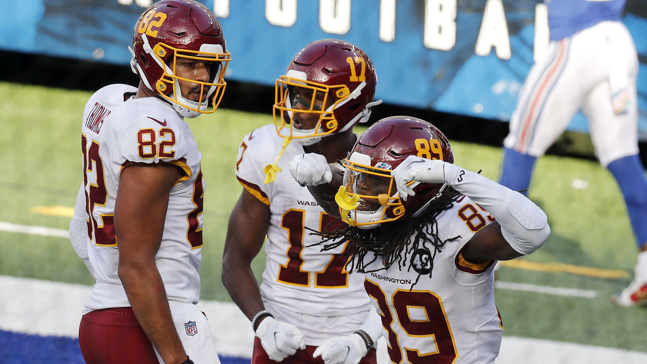 EAST RUTHERFORD, NEW JERSEY - OCTOBER 18: (NEW YORK DAILIES OUT) Cam Sims #89 of the Washington Football Team celebrates his fourth quarter touchdown against the New York Giants with teammates Logan Thomas #82 and Terry McLaurin #17 at MetLife Stadium on October 18, 2020 in East Rutherford, New Jersey. The Giants defeated Washington 20-19.