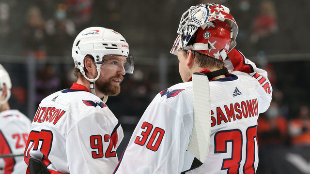 PHILADELPHIA, PA - APRIL 17: Ilya Samsonov #30 and Evgeny Kuznetsov #92 of the Washington Capitals gather during a timeout against the Philadelphia Flyers at the Wells Fargo Center on April 17, 2021 in Philadelphia, Pennsylvania.