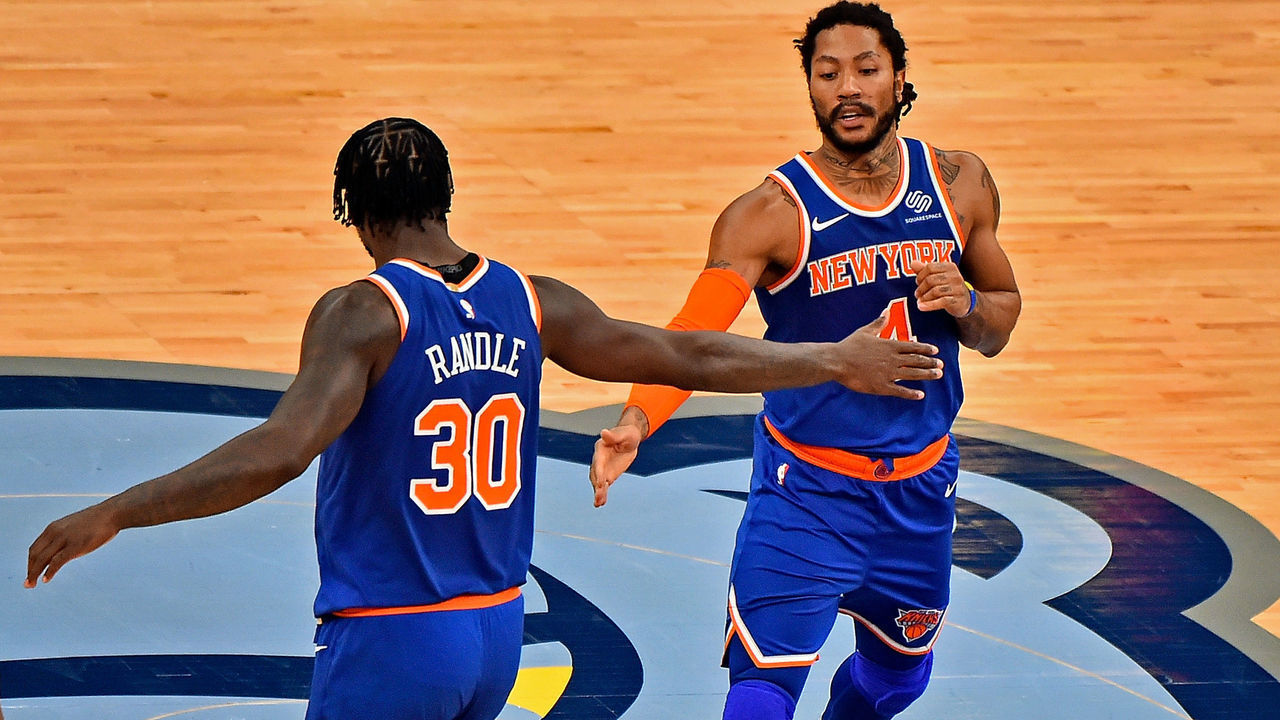 MEMPHIS, TENNESSEE - MAY 03: Julius Randle #30 of the New York Knicks and Derrick Rose #4 of the New York Knicks slap hands during the first half against the Memphis Grizzlies at FedExForum on May 03, 2021 in Memphis, Tennessee.