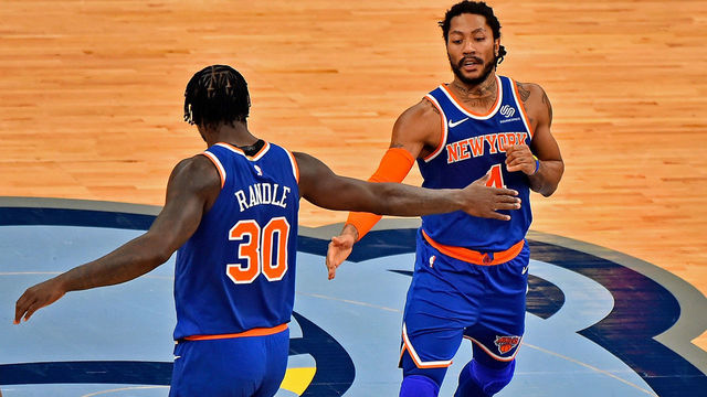 MEMPHIS, TENNESSEE - MAY 03: Julius Randle #30 of the New York Knicks and Derrick Rose #4 of the New York Knicks slap hands during the first half against the Memphis Grizzlies at FedExForum on May 03, 2021 in Memphis, Tennessee.