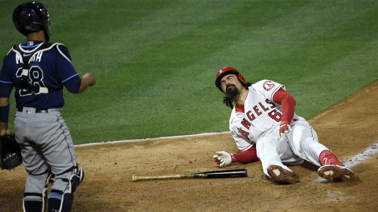 ANAHEIM, CA - MAY 03: Anthony Rendon #6 of the Los Angeles Angels grimaces in pain after fouling off the ball off his left foot during the eight inning against the Tampa Bay Rays at Angel Stadium of Anaheim on May 3, 2021 in Anaheim, California. Rendon was helped off the field and did not return.