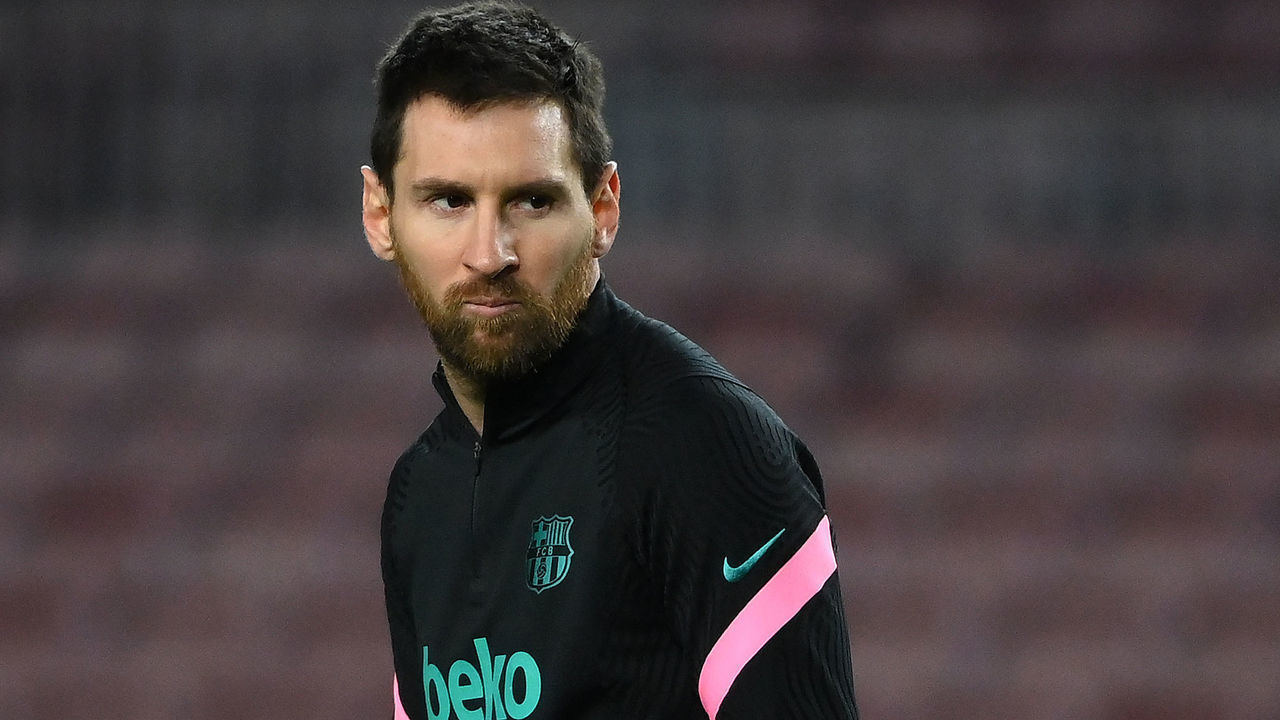 Barcelona's Argentinian forward Lionel Messi walks on the pitch before the UEFA Champions League round of 16 first leg football match between FC Barcelona and Paris Saint-Germain FC at the Camp Nou stadium in Barcelona on February 16, 2021.