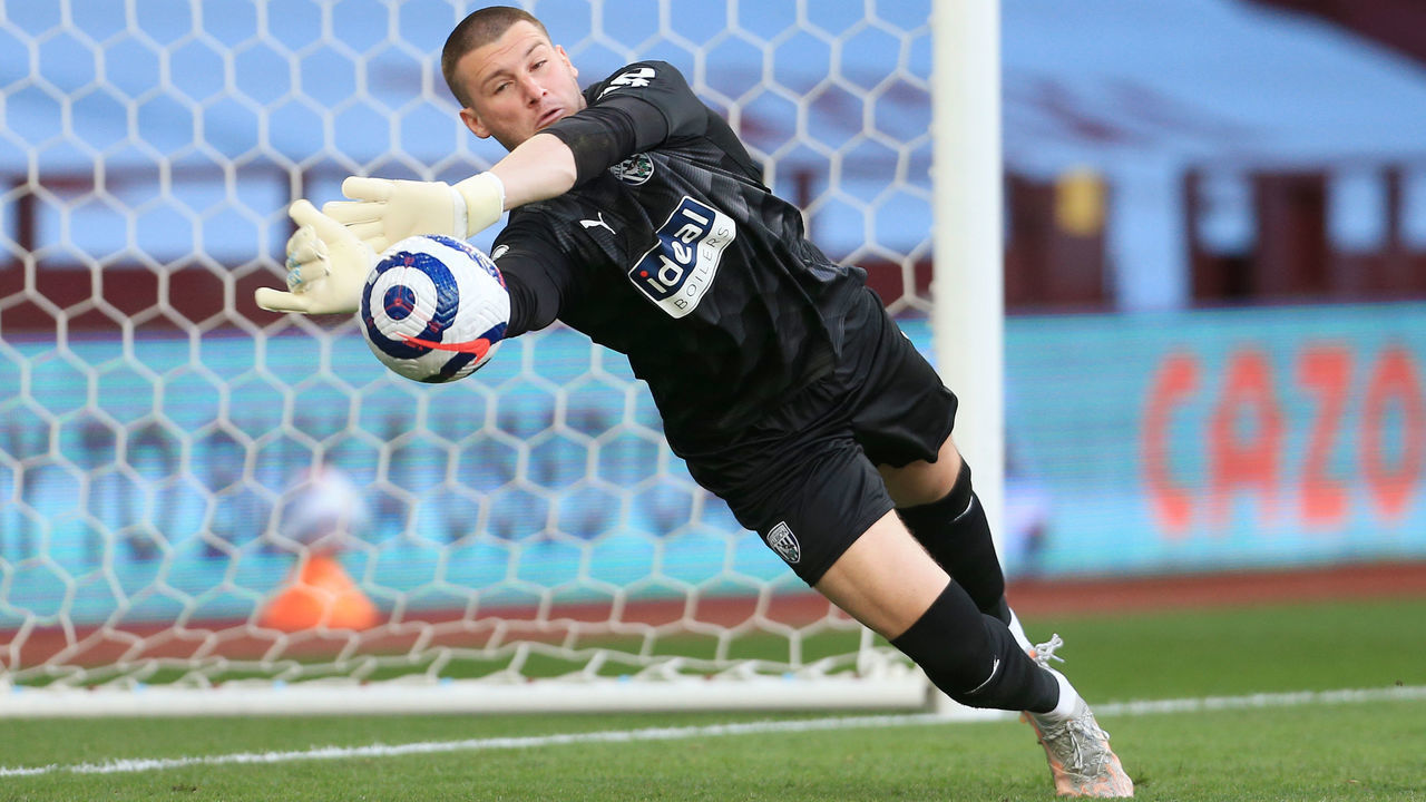 BIRMINGHAM, ENGLAND - APRIL 25: West Bromwich Albion goalkeeper Sam Johnstone dives to make a save during the Premier League match between Aston Villa and West Bromwich Albion at Villa Park on April 25, 2021 in Birmingham, United Kingdom. Sporting stadiums around the UK remain under strict restrictions due to the Coronavirus Pandemic as Government social distancing laws prohibit fans inside venues resulting in games being played behind closed doors.