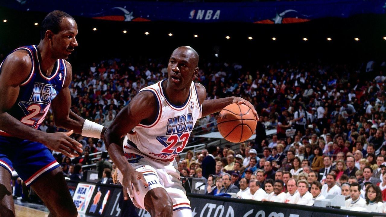 ORLANDO, FL - FEBRUARY 9: Michael Jordan #23 of the Eastern Conference All Stars drives against Clyde Drexler #22 of the Western Conference All Stars during the 1992 NBA All-Star Game at the Orlando Arena on February 9, 1992 in Orlando, Florida . NOTE TO USER: User expressly acknowledges and agrees that, by downloading and/or using this Photograph, user is consenting to the terms and conditions of the Getty Images License Agreement. Mandatory Copyright Notice: Copyright 1992 NBAE