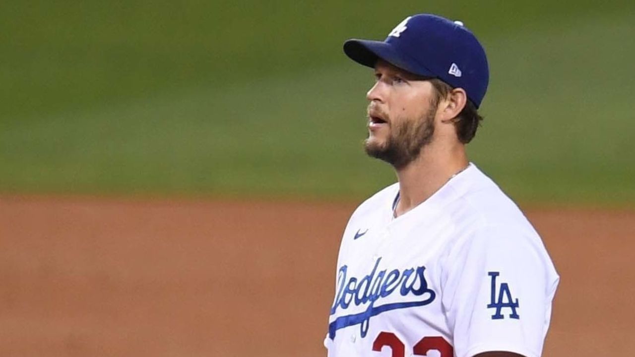 Los Angeles, CA - April 23: Starting pitcher Clayton Kershaw #22 of the Los Angeles Dodgers looks on after giving up a solo home run and the second of the game to Fernando Tatis Jr. (not pictured) of the San Diego Padres in the fifth inning of a baseball game at Dodger Stadium in Los Angeles on Friday, April 23, 2021.