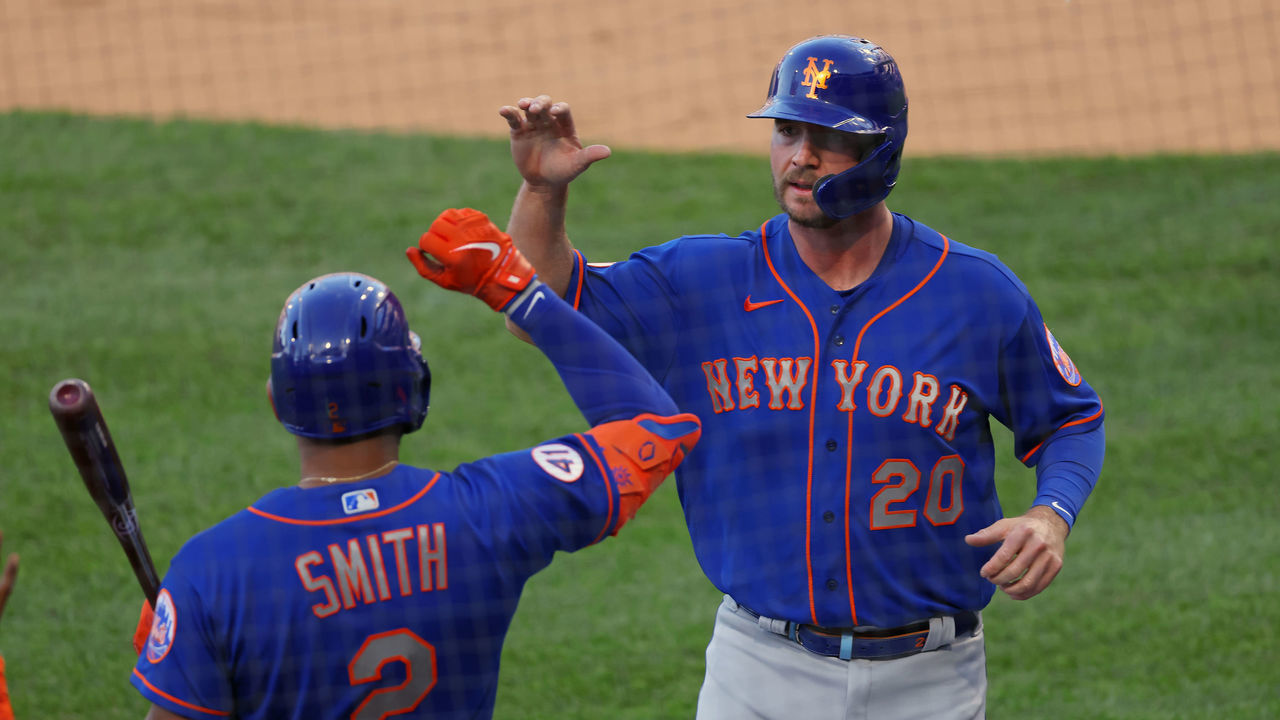 PHILADELPHIA, PA - MAY 01: Pete Alonso #20 of the New York Mets is congratulated by Dominic Smith #2 after scoring on a double hit by Michael Conforto #30 during the first inning of a game at Citizens Bank Park on May 1, 2021 in Philadelphia, Pennsylvania.