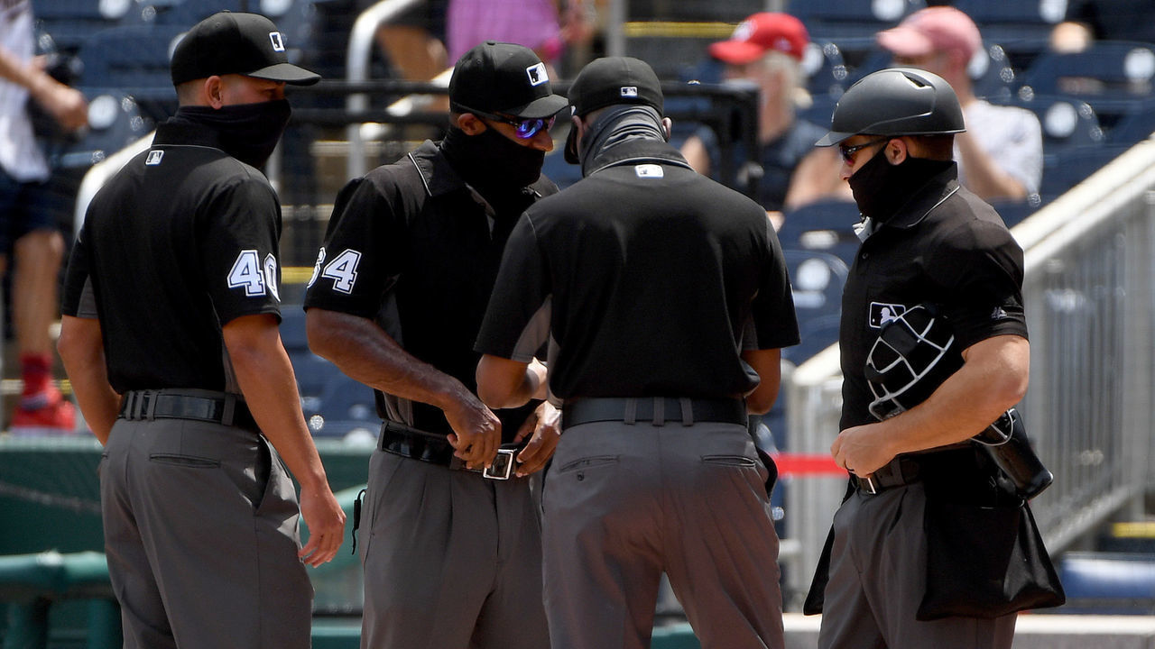 WASHINGTON, DC - MAY 02: Umpires talk prior to the game between the Washington Nationals and the Miami Marlins at Nationals Park on May 02, 2021 in Washington, DC.