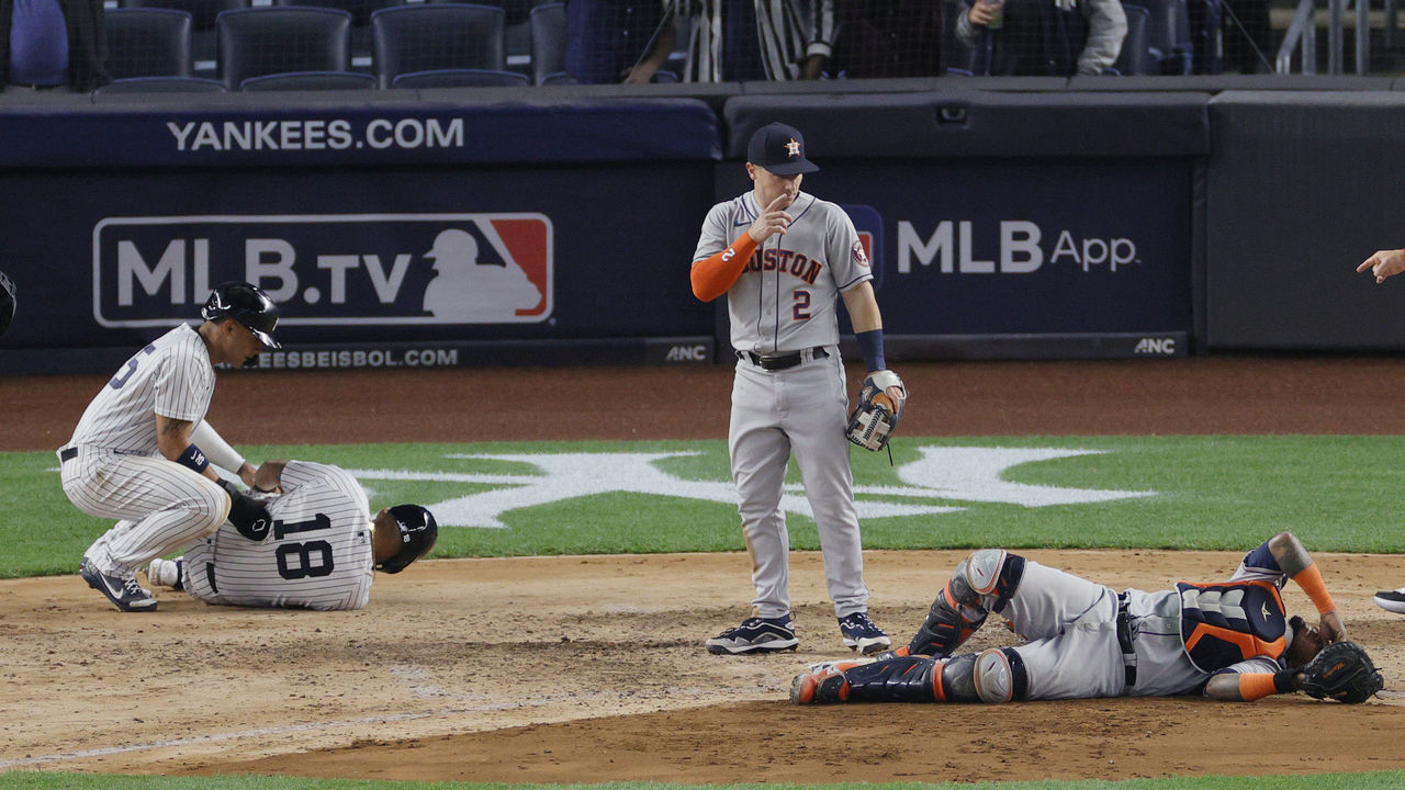 NEW YORK, NEW YORK - MAY 04: Gleyber Torres #25 checks on Rougned Odor #18 of the New York Yankees as Alex Bregman #2 checks on Martin Maldonado #15 of the Houston Astros after Odor and Maldonado collided during the sixth inning at Yankee Stadium on May 04, 2021 in the Bronx borough of New York City. The Yankees won 7-3.