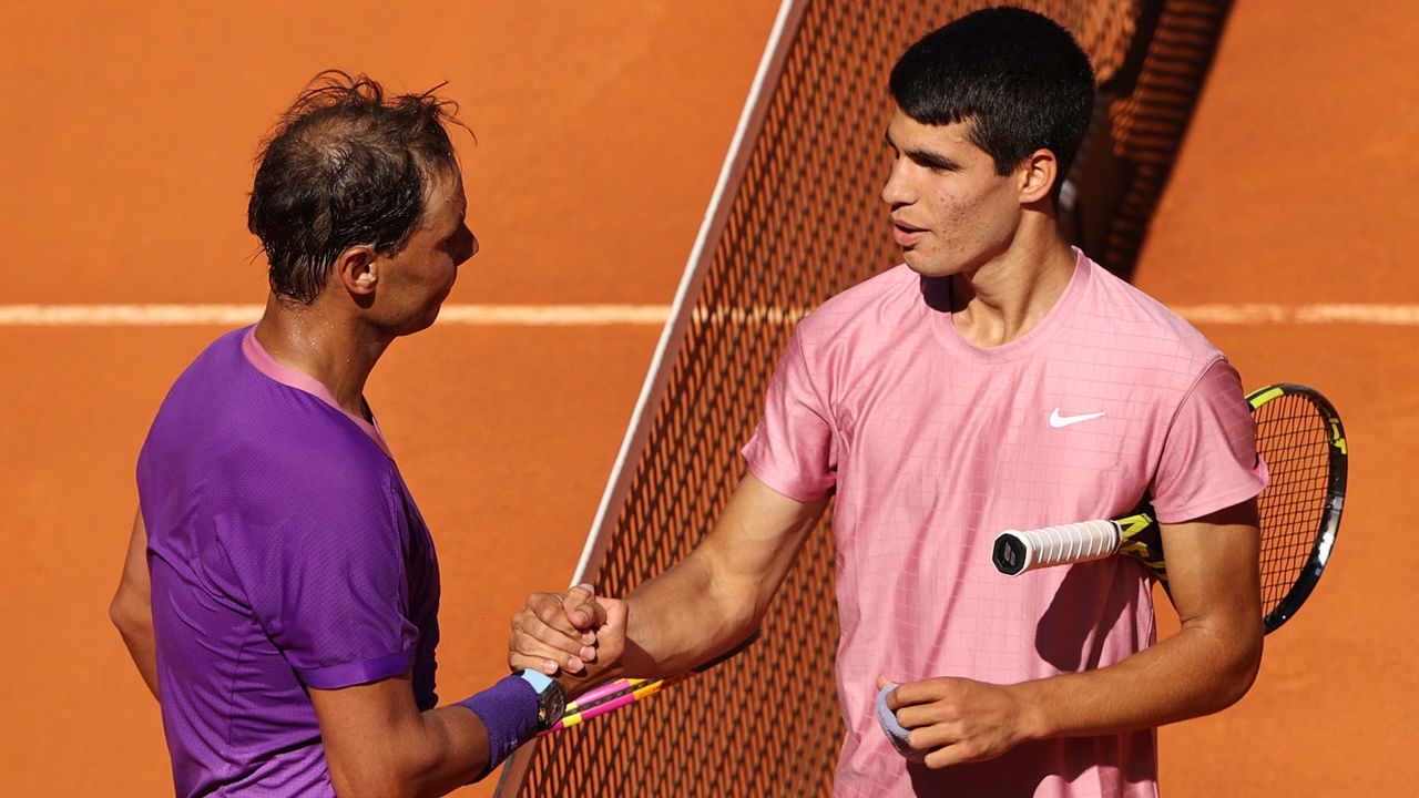 MADRID, SPAIN - MAY 05: Rafael Nadal of Spain shakes hands with Carlos Alcaraz of Spain after winning their second round match during day seven of the Mutua Madrid Open at La Caja Magicaon May 05, 2021 in Madrid, Spain.