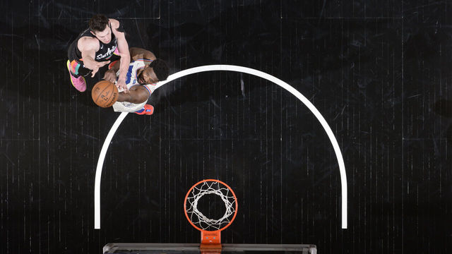 SAN ANTONIO, TX - MAY 2: Drew Eubanks #14 of the San Antonio Spurs shoots the ball during the game as Joel Embiid #21 of the Philadelphia 76ers plays defense on May 2, 2021 at the AT&T Center in San Antonio, Texas. Mandatory Copyright Notice: Copyright 2021 NBAE (Photos by Logan Riely/NBAE via Getty Images)