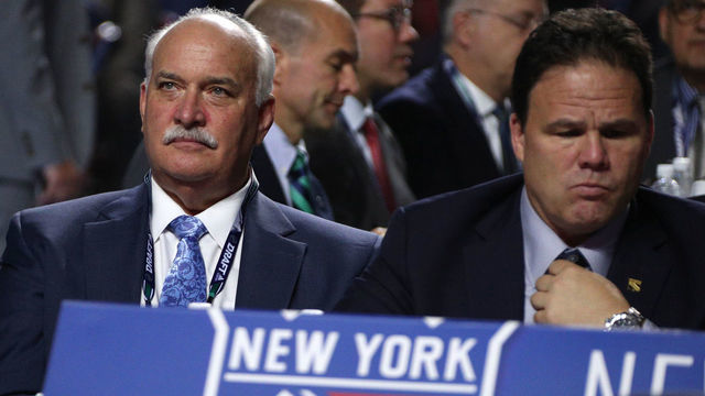 VANCOUVER, BRITISH COLUMBIA - JUNE 21: President John Davidson (L) and general manager Jeff Gorton of the New York Rangers look on from the team draft table during Rounds 2-7 of the 2019 NHL Draft at Rogers Arena on June 22, 2019 in Vancouver, Canada.