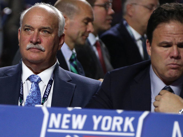 VANCOUVER, BRITISH COLUMBIA - JUNE 21: President John Davidson (L) and general manager Jeff Gorton of the New York Rangers look on from the team draft table during Rounds 2-7 of the 2019 NHL Draft at Rogers Arena on June 22, 2019 in Vancouver, Canada.