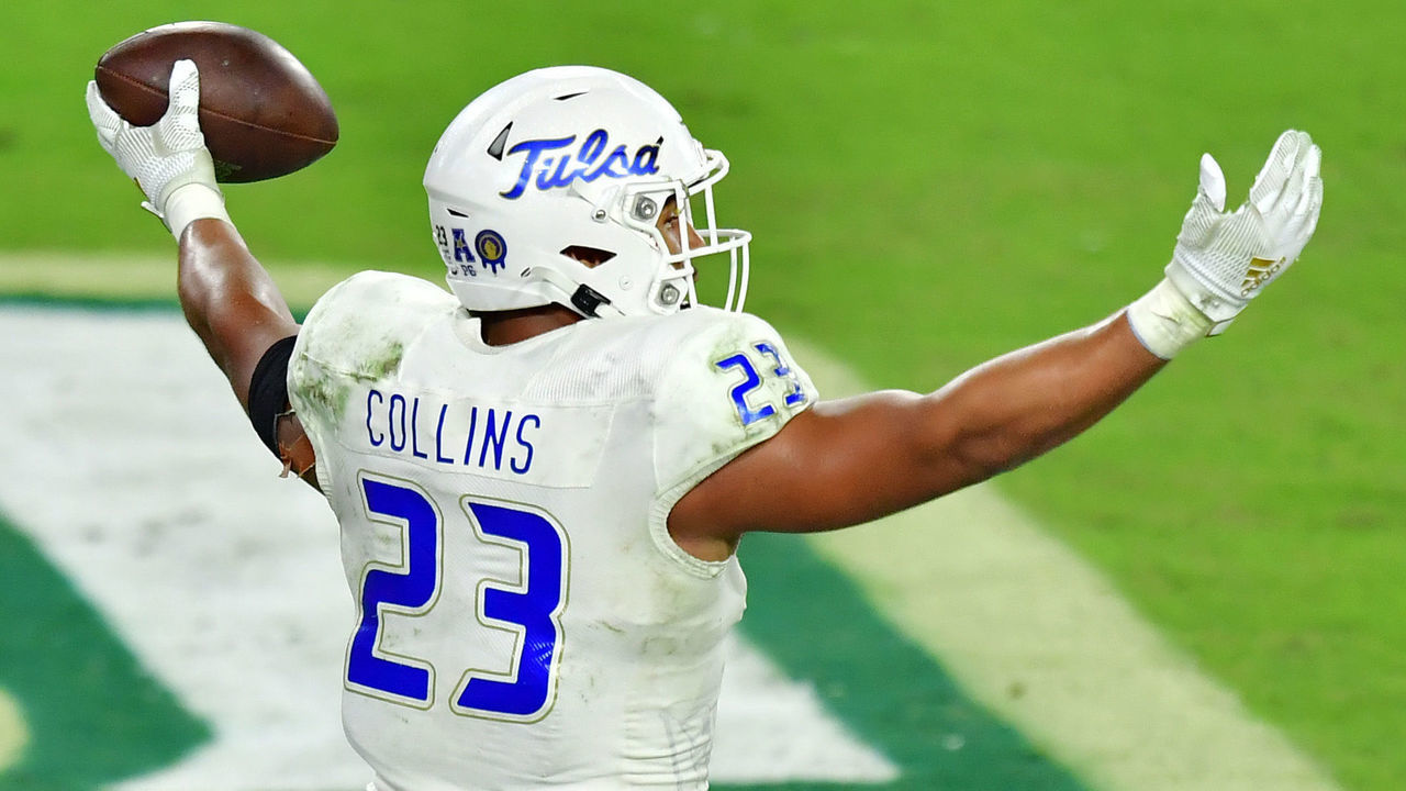 TAMPA, FLORIDA - OCTOBER 23: Zaven Collins #23 of the Tulsa Golden Hurricane celebrates after intercepting Noah Johnson #0 of the South Florida Bulls and running in a 38-yard touchdown during the third quarter at Raymond James Stadium on October 23, 2020 in Tampa, Florida.