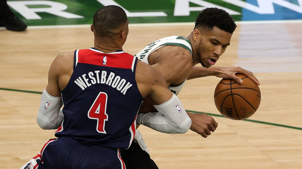 MILWAUKEE, WISCONSIN - MAY 05: Giannis Antetokounmpo #34 of the Milwaukee Bucks is defended by Russell Westbrook #4 of the Washington Wizards during the second half of a game at Fiserv Forum on May 05, 2021 in Milwaukee, Wisconsin.