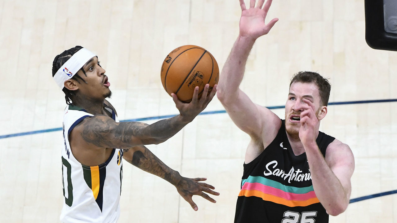 SALT LAKE CITY, UTAH - MAY 05: Jordan Clarkson #00 of the Utah Jazz takes a shot over Jakob Poeltl #25 of the San Antonio Spurs during a game at Vivint Smart Home Arena on May 5, 2021 in Salt Lake City, Utah. NOTE TO USER: User expressly acknowledges and agrees that, by downloading and/or using this photograph, user is consenting to the terms and conditions of the Getty Images License Agreement.