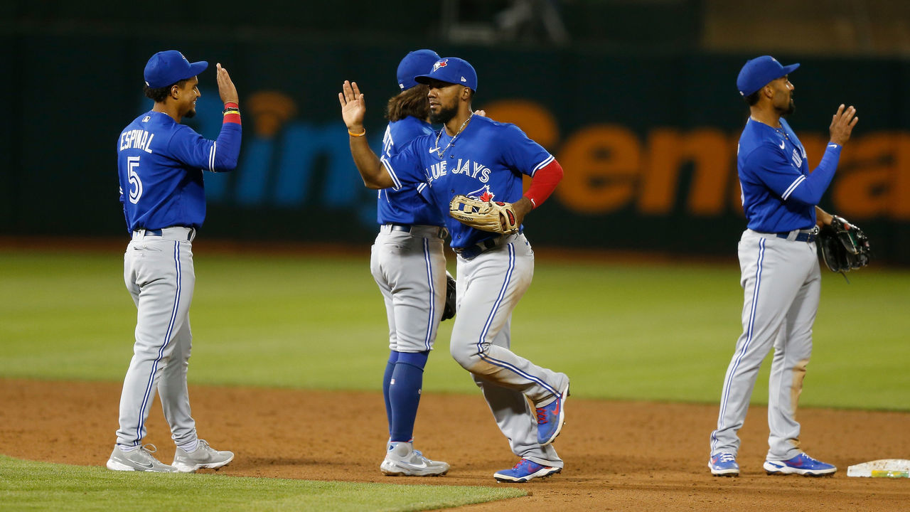 OAKLAND, CALIFORNIA - MAY 05: Toronto Blue Jays players celebrate after a win against the Oakland Athletics at RingCentral Coliseum on May 05, 2021 in Oakland, California.