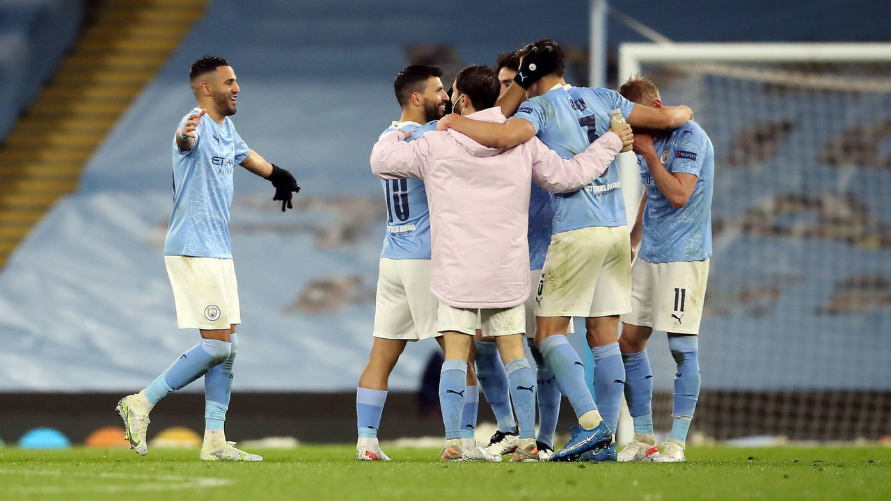 Manchester City's Riyad Mahrez (left) and his team-mates celebrate after the final whistle of the UEFA Champions League Semi Final second leg at the Etihad Stadium, Manchester. Picture date: Tuesday May 4, 2021.