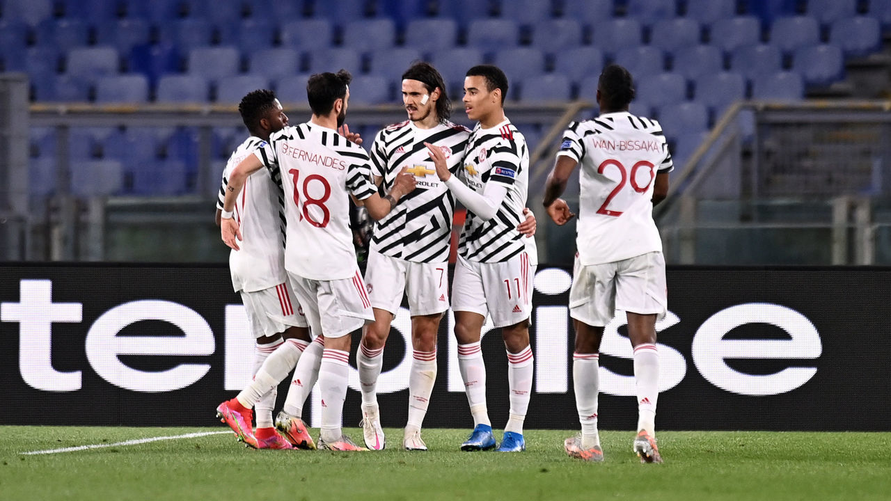 ROME, ITALY - MAY 06: Edinson Cavani of Manchester United celebrates with team mates (L - R) Fred, Bruno Fernandes and Mason Greenwood after scoring their side's first goal during the UEFA Europa League Semi-final Second Leg match between AS Roma and Manchester United at Stadio Olimpico on May 06, 2021 in Rome, Italy. Sporting stadiums around Europe remain under strict restrictions due to the Coronavirus Pandemic as Government social distancing laws prohibit fans inside venues resulting in games being played behind closed doors.