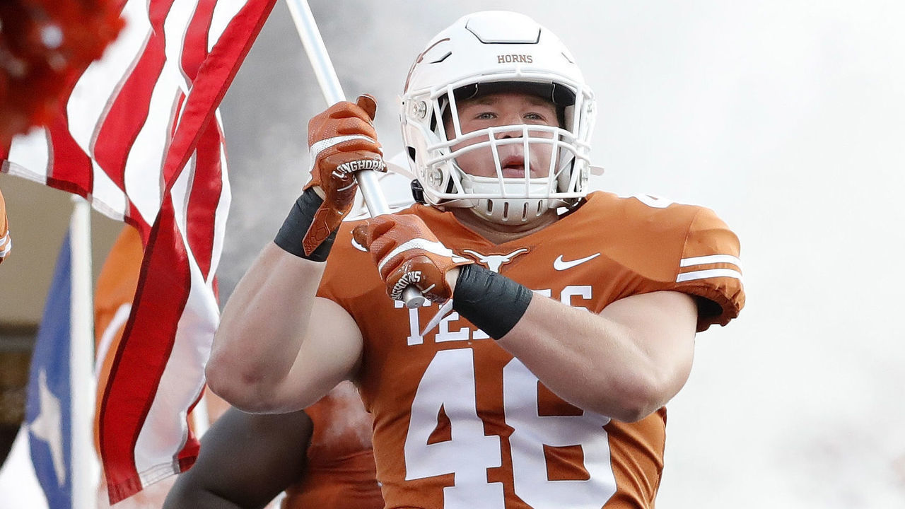AUSTIN, TX - AUGUST 31: Collin Johnson #9 of the Texas Longhorns and Jake Ehlinger #48 enter the stadium before the game against the Louisiana Tech Bulldogs at Darrell K Royal-Texas Memorial Stadium on August 31, 2019 in Austin, Texas.