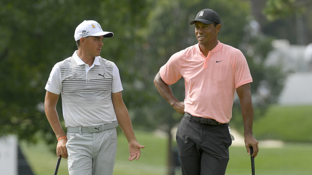 NEWTOWN SQUARE, PA - SEPTEMBER 07: Rickie Fowler and Tiger Woods chat on the 11th green during the second round of the BMW Championship at Aronimink Golf Club on September 7, 2018 in Newtown Square, Pennsylvania.