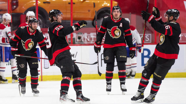 OTTAWA, ON - MAY 5: Alex Formenton #59 of the Ottawa Senators celebrates his third period goal against the Montreal Canadiens with teammates Colin White #36, Nick Paul #13 and Victor Mete #98 at Canadian Tire Centre on May 5, 2021 in Ottawa, Ontario, Canada.