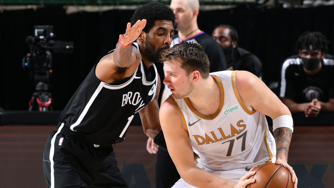 DALLAS, TX - MAY 6: Kyrie Irving #11 of the Brooklyn Nets plays defense on Luka Doncic #77 of the Dallas Mavericks during the game on May 6, 2021 at the American Airlines Center in Dallas, Texas. Mandatory Copyright Notice: Copyright 2021 NBAE