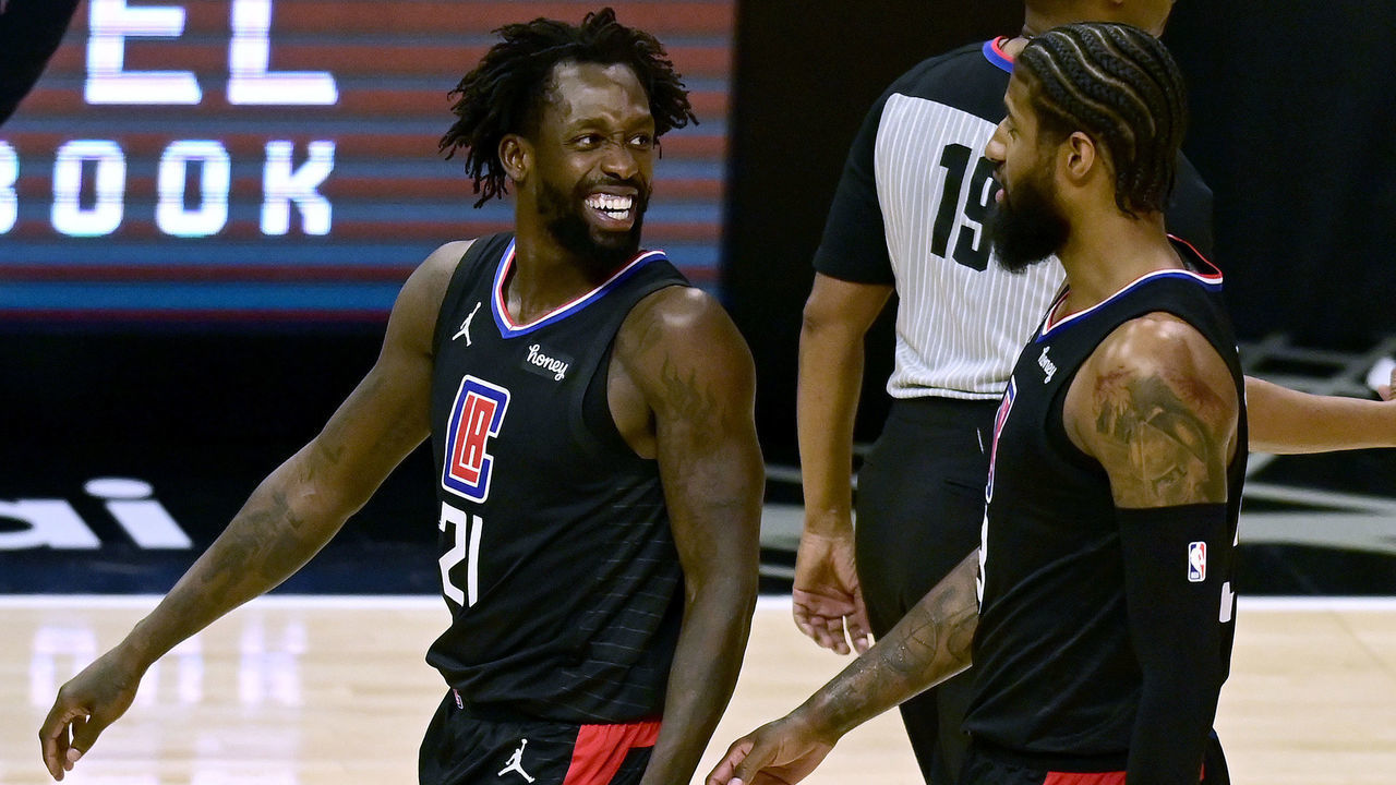 LOS ANGELES, CALIFORNIA - MAY 06: Patrick Beverley #21 and Paul George #13 of the LA Clippers laugh as they leave the court with a lead over the Los Angeles Lakers during the fourth quarter at Staples Center on May 06, 2021 in Los Angeles, California.