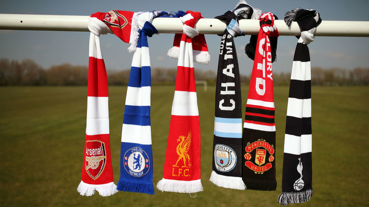 A selection of scarves pictured at Hackney Marshes, London, of the English soccer Premier League teams (left-right) Arsenal, Chelsea, Liverpool, Manchester City, Manchester United and Tottenham Hotspur, who announced in a joint statement they are to join a new European Super League. Picture date: Monday April 19, 2021.