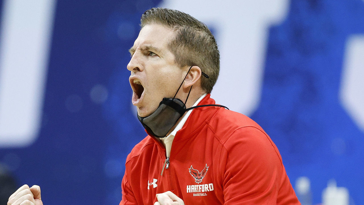 INDIANAPOLIS, INDIANA - MARCH 19: Head coach John Gallagher of the Hartford Hawks reacts during their game against the Baylor Bears in the first round of the 2021 NCAA Men's Basketball Tournament at Lucas Oil Stadium on March 19, 2021 in Indianapolis, Indiana.
