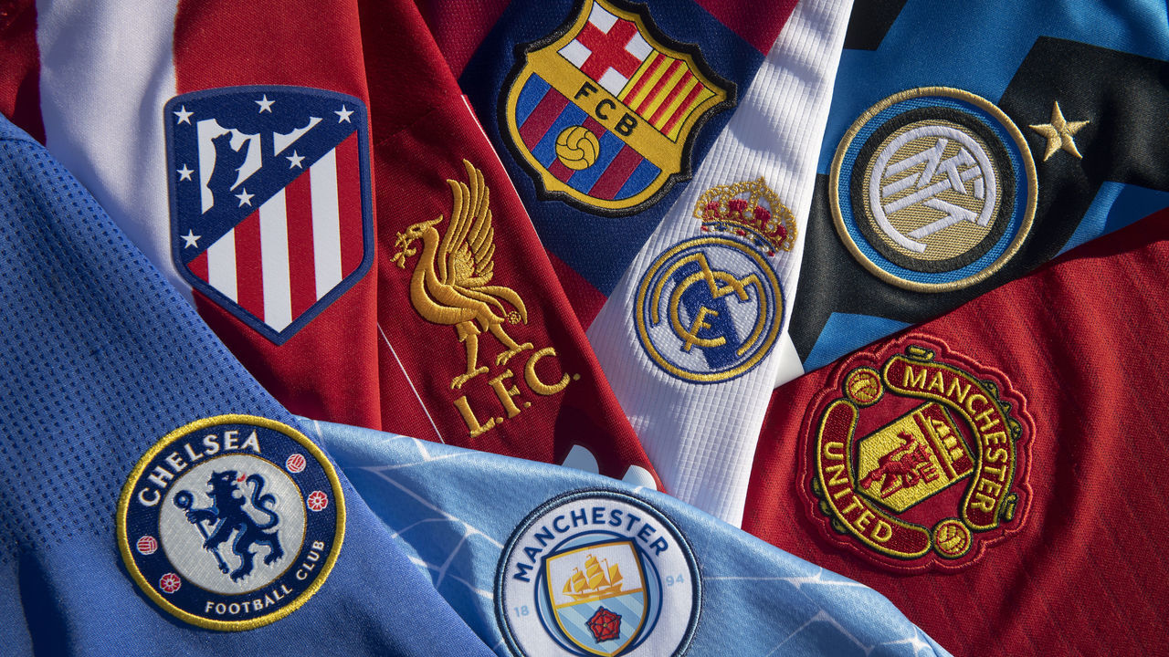 MANCHESTER, ENGLAND - APRIL 22: The club badges of some of the teams involved in the European Super League; Liverpool, Barcelona, Real Madrid, Inter Milan, Chelsea, Atletico Madrid, Manchester City and Manchester United on their first team home shirts on April 22, 2021 in Manchester, United Kingdom.