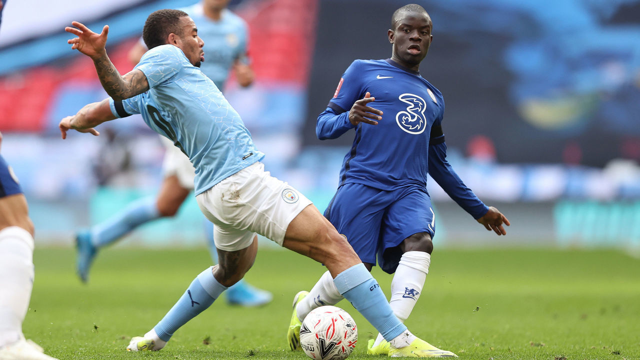 LONDON, ENGLAND - APRIL 17: N'Golo Kante of Chelsea passes the ball beneath the leg of Gabriel Jesus of Manchester City during the Semi Final of the Emirates FA Cup match between Manchester City and Chelsea FC at Wembley Stadium on April 17, 2021 in London, England. Sporting stadiums around the UK remain under strict restrictions due to the Coronavirus Pandemic as Government social distancing laws prohibit fans inside venues resulting in games being played behind closed doors.