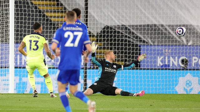 LEICESTER, ENGLAND - MAY 07: Callum Wilson of Newcastle United scores past Kasper Schmeichel of Leicester City to make it 0-4 during the Premier League match between Leicester City and Newcastle United at The King Power Stadium on May 7, 2021 in Leicester, United Kingdom. Sporting stadiums around the UK remain under strict restrictions due to the Coronavirus Pandemic as Government social distancing laws prohibit fans inside venues resulting in games being played behind closed doors.