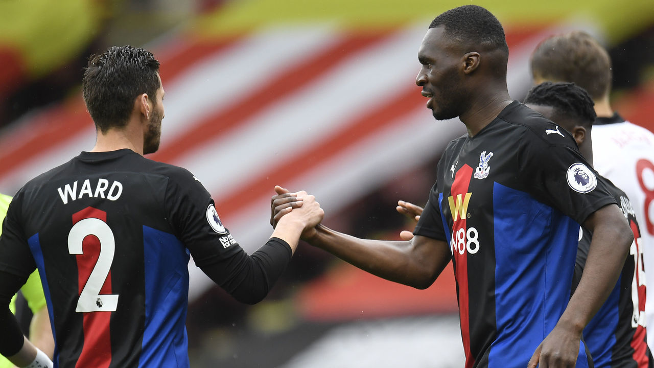 SHEFFIELD, ENGLAND - MAY 08: Christian Benteke of Crystal Palace celebrates with Joel Ward and team mates after scoring their side's first goal during the Premier League match between Sheffield United and Crystal Palace at Bramall Lane on May 08, 2021 in Sheffield, England. Sporting stadiums around the UK remain under strict restrictions due to the Coronavirus Pandemic as Government social distancing laws prohibit fans inside venues resulting in games being played behind closed doors.