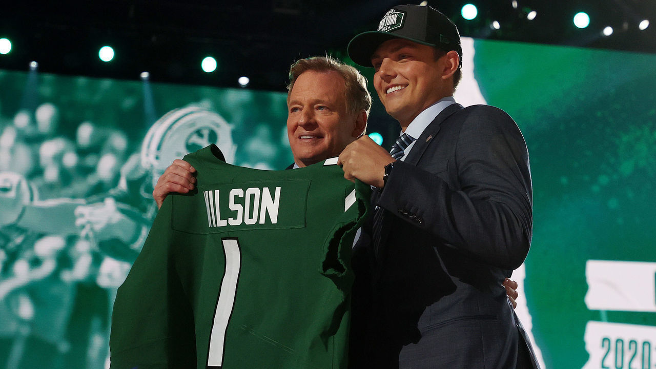 CLEVELAND, OHIO - APRIL 29: Zach Wilson stands onstage with NFL Commissioner Roger Goodell after being drafted second by the New York Jets during round one of the 2021 NFL Draft at the Great Lakes Science Center on April 29, 2021 in Cleveland, Ohio.