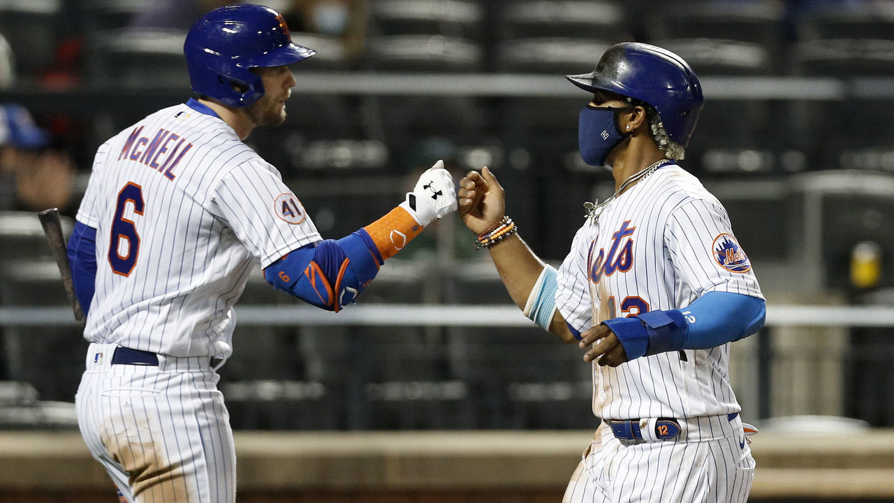 NEW YORK, NEW YORK - APRIL 14: (NEW YORK DAILIES OUT) Francisco Lindor #12 and Jeff McNeil #6 of the New York Mets in action against the Philadelphia Phillies at Citi Field on April 14, 2021 in New York City. The Mets defeated the Phillies 5-1.