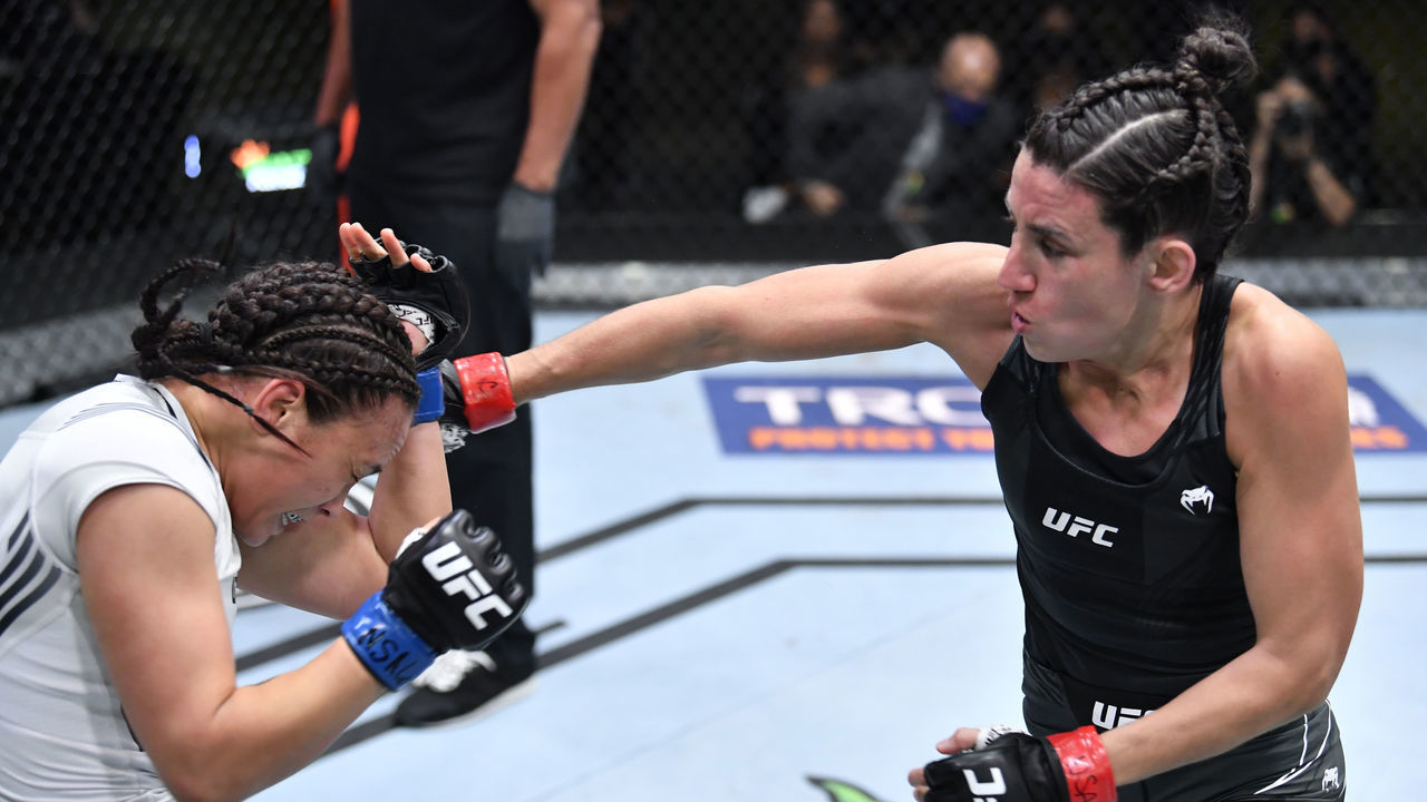 LAS VEGAS, NEVADA - MAY 08: (R-L) Marina Rodriguez of Brazil punches Michelle Waterson in a flyweight fight during the UFC Fight Night event at UFC APEX on May 08, 2021 in Las Vegas, Nevada.